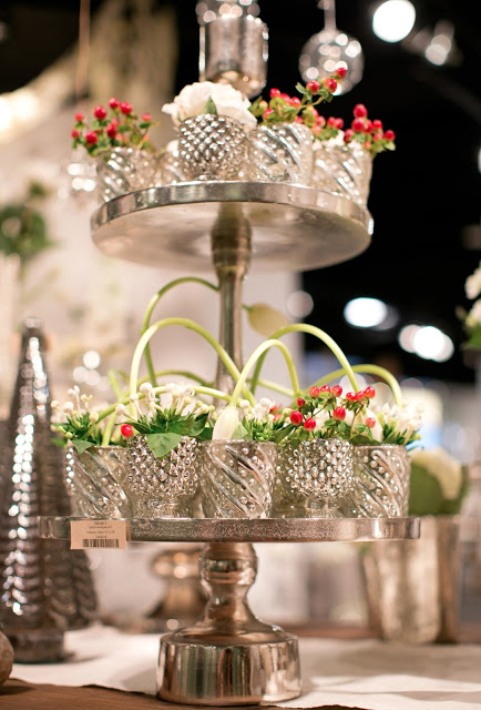Display table with mercury glass and Christmas florals in Accent Decor